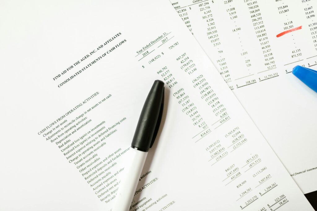 pexels-photo-7821554-7821554 Financial documents featuring cash flows and pens, ideal for business themes and analysis.